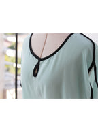 Blusa verde agua detalle negro manga corta fluida | Talla M